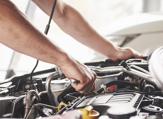 Technician repairing a vehicle