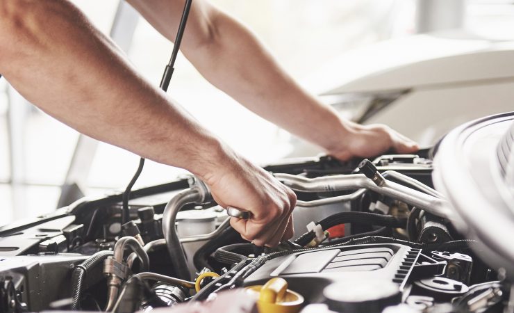 Technician repairing a vehicle