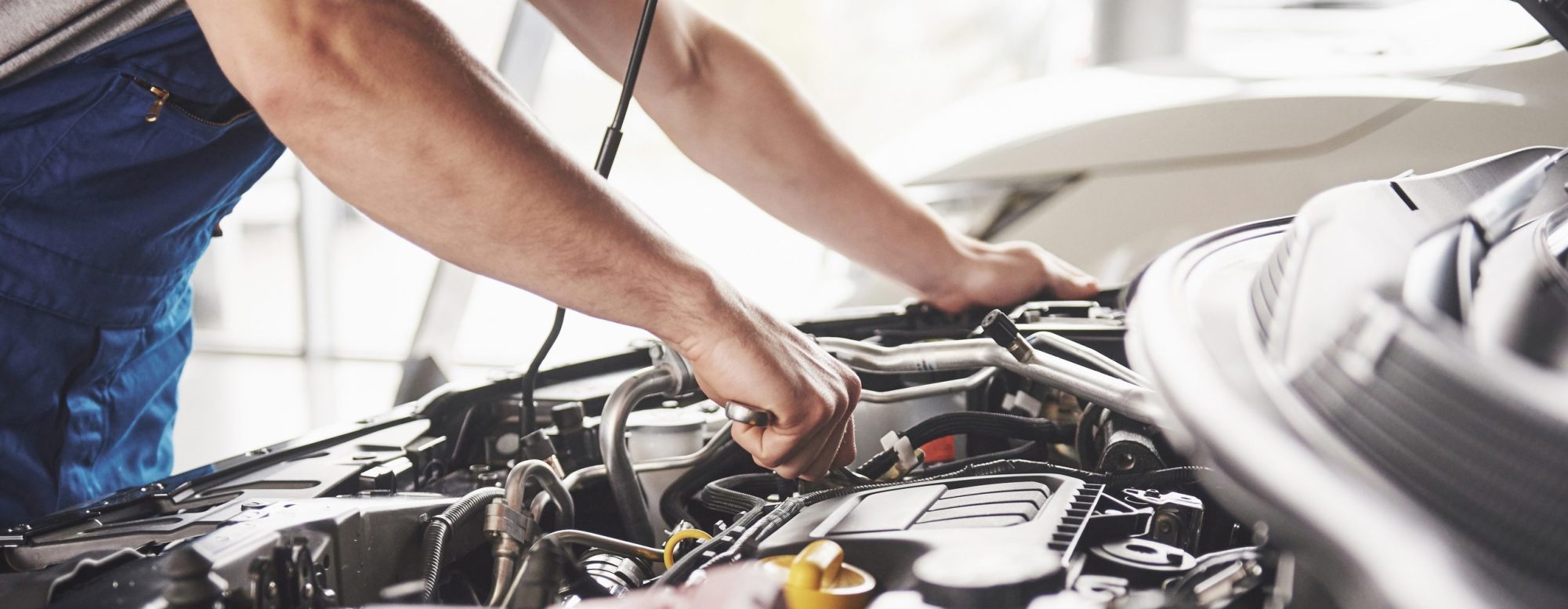 Technician repairing a vehicle